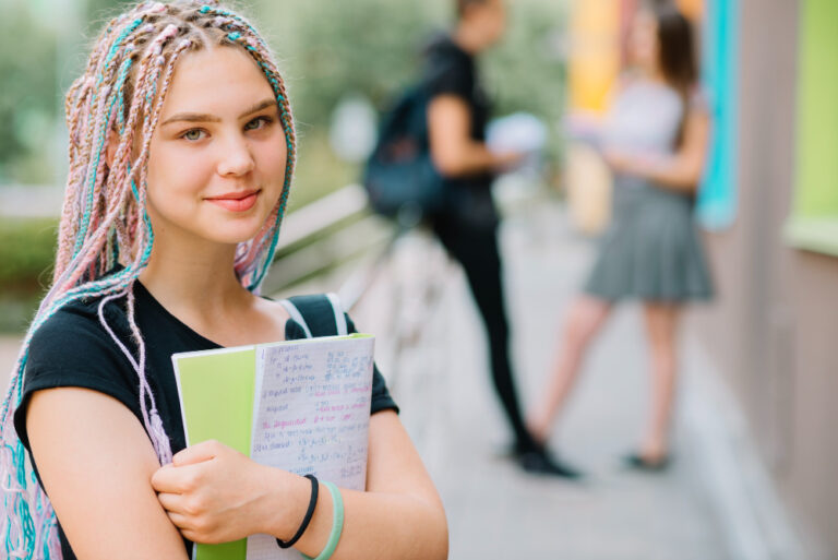 smiling-teen-girl-with-book